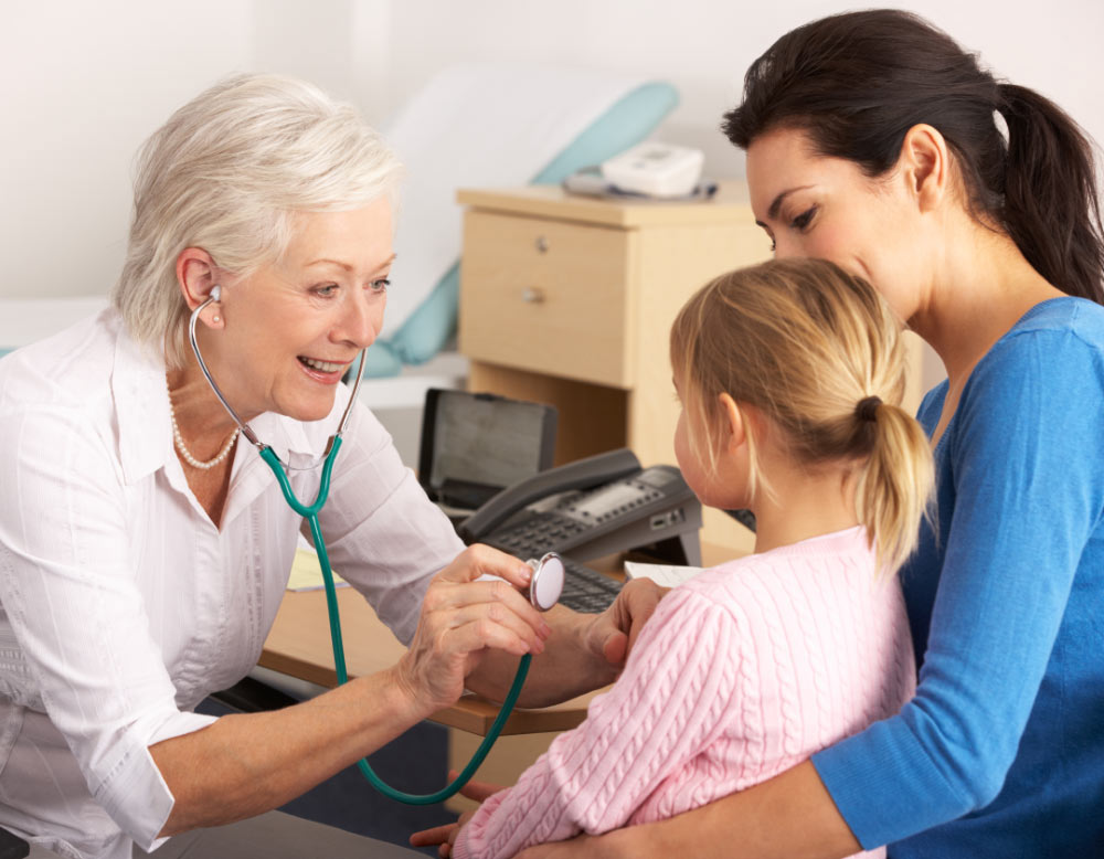 A physician examining a child